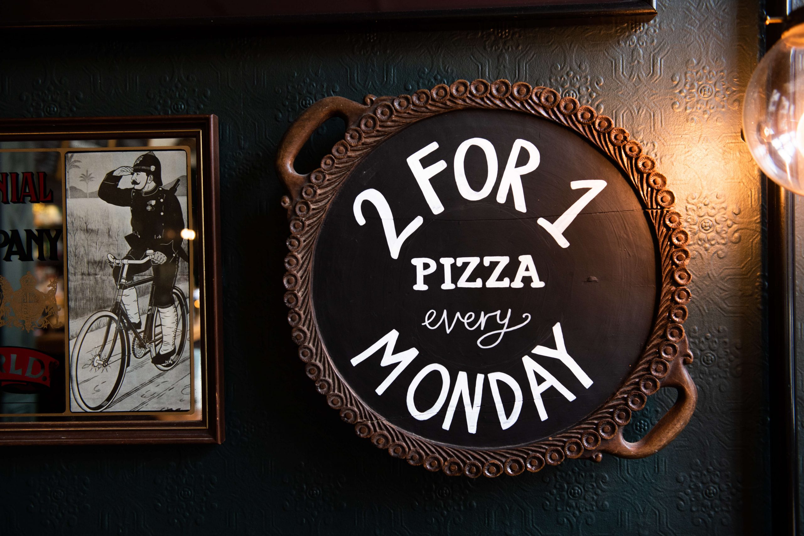 Chalk sign for two-for-one pizza every Monday