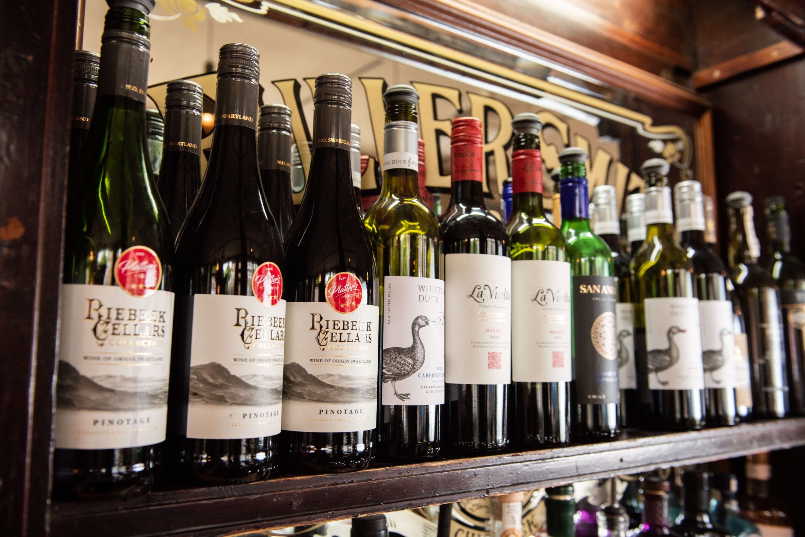 Wine on the shelf behind the bar